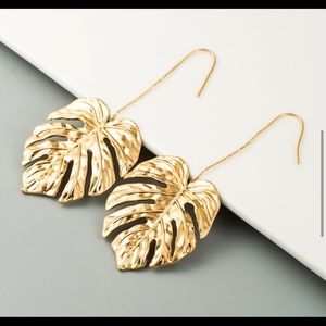 Palm leaf dangle statement earrings.